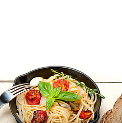 Image showing spaghetti pasta with baked cherry tomatoes and basil 