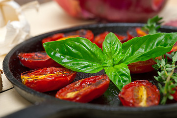 Image showing baked cherry tomatoes with basil and thyme