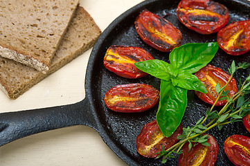 Image showing baked cherry tomatoes with basil and thyme