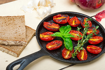 Image showing baked cherry tomatoes with basil and thyme