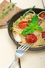 Image showing spaghetti pasta with baked cherry tomatoes and basil 