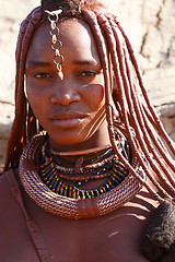 Image showing Himba woman with ornaments on the neck in the village