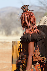 Image showing Himba woman with ornaments on the neck in the village