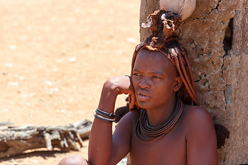 Image showing Himba woman with ornaments on the neck in the village