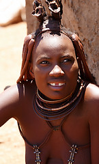 Image showing Himba woman with ornaments on the neck in the village