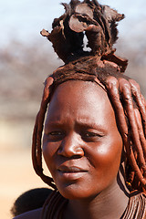 Image showing Himba woman with ornaments on the neck in the village