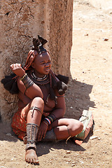 Image showing Himba woman with ornaments on the neck in the village