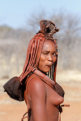 Image showing Himba woman with ornaments on the neck in the village