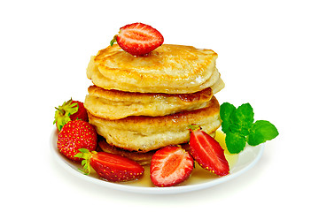 Image showing Flapjacks with strawberries and mint in plate