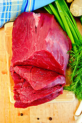 Image showing Meat beef with ginger on wooden board