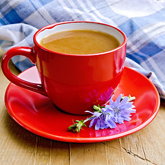 Image showing Chicory drink in red cup with napkin on board