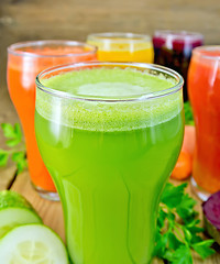 Image showing Juice cucumber and vegetable in glass with vegetables on board