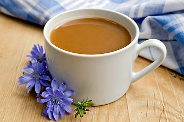 Image showing Chicory drink in white cup with flower on board