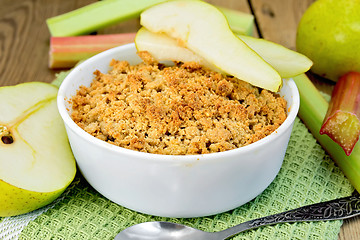 Image showing Crumble with pears and rhubarb on board