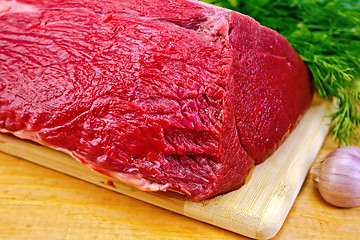 Image showing Meat beef whole piece on wooden board