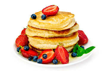 Image showing Flapjacks with strawberries and blueberries in plate