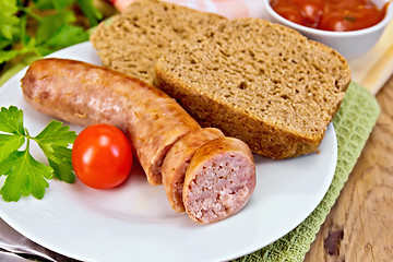 Image showing Sausages pork grilled in plate with bread on board