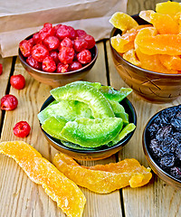 Image showing Candied pomelo and berries in bowl on board