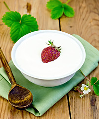 Image showing Yogurt thick with strawberries in bowl on board