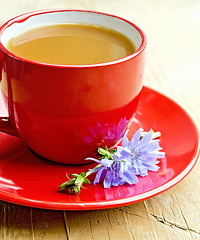 Image showing Chicory drink in red cup with flower on saucer