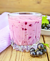 Image showing Milkshake with black currants with napkin