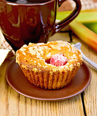 Image showing Cupcakes with rhubarb and mug on board