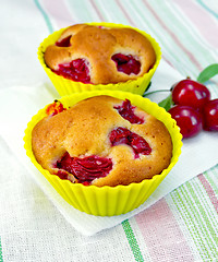 Image showing Cupcakes with cherries on napkin