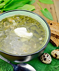 Image showing Soup green of sorrel and spinach on board with eggs