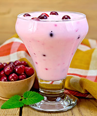 Image showing Yogurt thick with cranberries and napkin on board