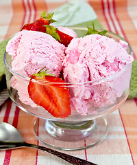 Image showing Ice cream strawberry in glass goblet on tablecloth