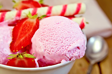 Image showing Ice cream strawberry in bowl with waffles on board