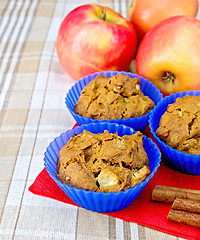 Image showing Cupcake rye with apple in tins on fabric