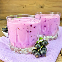 Image showing Milkshake with black currants on napkin