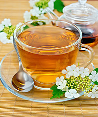 Image showing Tea from flowers of viburnum on bamboo napkin