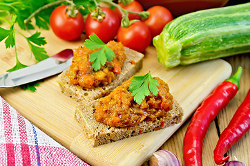 Image showing Sandwich with caviar squash and peppers on board