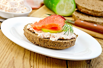 Image showing Sandwich with cream and salmon in oval plate on board