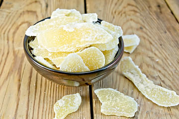 Image showing Candied ginger in bowl on board