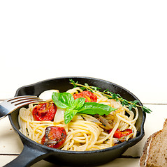 Image showing spaghetti pasta with baked cherry tomatoes and basil 