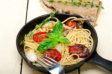 Image showing spaghetti pasta with baked cherry tomatoes and basil 