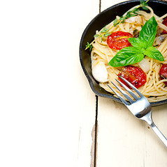 Image showing spaghetti pasta with baked cherry tomatoes and basil 