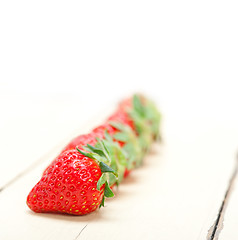 Image showing fresh organic strawberry over white wood