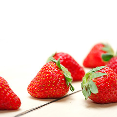 Image showing fresh organic strawberry over white wood