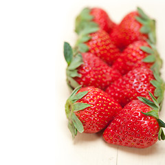 Image showing fresh organic strawberry over white wood