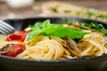 Image showing spaghetti pasta with baked cherry tomatoes and basil 