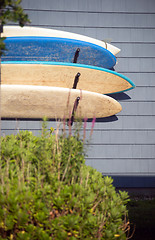 Image showing worn surfboards hanging from trailer house Montauk New York USA