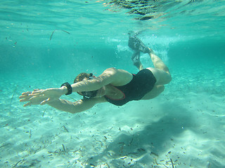 Image showing Female swimmer diving underwater