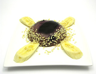 Image showing Chocolate pudding with blueberries, banana and pieces of almonds