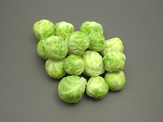 Image showing Several Brussels sprouts on a dull matting