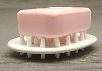 Image showing Pink soap on a soap dish on a gray background