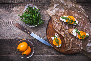 Image showing rustic style Bruschetta snacks with tomatoes and salad rocket 